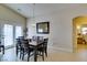 Cozy dining room with a wooden table set and access to the outdoor patio at 9524 Tyler Rose St, Las Vegas, NV 89178
