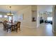 Open-concept dining room with a chandelier and clear views into the Gathering room at 9524 Tyler Rose St, Las Vegas, NV 89178