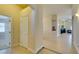 Bright foyer hallway with neutral paint and tile flooring leading to living areas at 9524 Tyler Rose St, Las Vegas, NV 89178