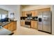 Well-lit kitchen featuring stainless appliances, sleek granite countertops, and ample cabinet space at 9524 Tyler Rose St, Las Vegas, NV 89178