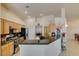Stylish kitchen featuring granite countertops, stainless steel appliances, and bright recessed lighting at 9524 Tyler Rose St, Las Vegas, NV 89178