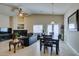 Combined living and dining room with ample natural light and comfortable seating at 9524 Tyler Rose St, Las Vegas, NV 89178