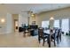 Spacious living and dining area featuring tile flooring, and access to other parts of the house at 9524 Tyler Rose St, Las Vegas, NV 89178