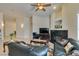 View of an open concept living room with tile flooring, fireplace, and comfortable seating at 9524 Tyler Rose St, Las Vegas, NV 89178