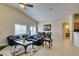 Comfortable living room with a large sofa, vaulted ceilings, and clear view of the backyard at 9524 Tyler Rose St, Las Vegas, NV 89178