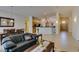 Open-concept space showcasing living room, dining area, and kitchen with tile flooring at 9524 Tyler Rose St, Las Vegas, NV 89178
