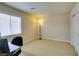 Carpeted office space with a window, closet, and base trim perfect for remote working or study at 9524 Tyler Rose St, Las Vegas, NV 89178