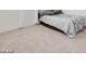 Cozy bedroom featuring neutral carpet and decor, a full-size bed with comfortable pillows at 10204 Kern Peak St, Las Vegas, NV 89166