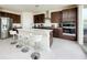 Stylish kitchen featuring stainless steel appliances, dark cabinets, and a bright white island at 10204 Kern Peak St, Las Vegas, NV 89166