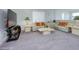 Cozy living room featuring neutral carpet and decor, dual sofas with comfortable pillows at 10204 Kern Peak St, Las Vegas, NV 89166