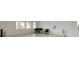 Bright multipurpose living room with chairs and a piano at 10204 Kern Peak St, Las Vegas, NV 89166