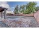 Low maintenance backyard features a patio and rock landscaping at 10311 Slope Ridge St, Las Vegas, NV 89131