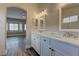 Elegant bathroom boasting double sinks with marble countertops at 10311 Slope Ridge St, Las Vegas, NV 89131