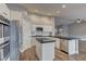 Modern kitchen with black granite counters, stainless appliances, and white cabinetry at 10311 Slope Ridge St, Las Vegas, NV 89131