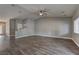 Spacious living room featuring wood-look floors, neutral paint and an open layout at 10311 Slope Ridge St, Las Vegas, NV 89131