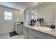 Bathroom showcasing dual sinks with granite countertops and modern fixtures at 10939 Cheshire Woods Ave, Las Vegas, NV 89166