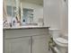Bathroom featuring a granite countertop, white cabinets, and a white toilet at 10939 Cheshire Woods Ave, Las Vegas, NV 89166