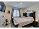 Bedroom with TV and window at 10939 Cheshire Woods Ave, Las Vegas, NV 89166