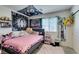 Decorated bedroom with a window at 10939 Cheshire Woods Ave, Las Vegas, NV 89166