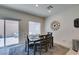 Cozy dining area with outdoor access and comfortable seating offers great natural light at 10939 Cheshire Woods Ave, Las Vegas, NV 89166