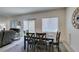 Comfortable dining space with a large window, blends seamlessly with the adjacent living area at 10939 Cheshire Woods Ave, Las Vegas, NV 89166