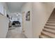 Inviting entryway with tile flooring, stairs, and living room views showcasing the open floorplan at 10939 Cheshire Woods Ave, Las Vegas, NV 89166