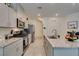 Bright kitchen features granite countertops and stainless steel appliances at 10939 Cheshire Woods Ave, Las Vegas, NV 89166