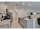Stylish kitchen includes granite countertops, modern appliances, and a large island for meal prep at 10939 Cheshire Woods Ave, Las Vegas, NV 89166