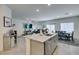 Kitchen with granite island opens to the dining and living areas at 10939 Cheshire Woods Ave, Las Vegas, NV 89166
