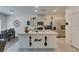 Kitchen with granite island, stainless appliances, and dining area at 10939 Cheshire Woods Ave, Las Vegas, NV 89166