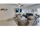 Comfortable living room with tile flooring, modern decor, and plenty of seating at 10939 Cheshire Woods Ave, Las Vegas, NV 89166