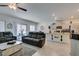 Bright living room with tile flooring, comfortable seating, and modern decor at 10939 Cheshire Woods Ave, Las Vegas, NV 89166