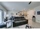 Open floor plan integrates living room with dining area and kitchen, creating a spacious feel at 10939 Cheshire Woods Ave, Las Vegas, NV 89166