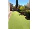 Backyard has artificial grass with a putting green at 11201 Newbury Hills Ave, Las Vegas, NV 89138
