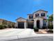 Attractive two-story home with a double garage and well-manicured front yard in a suburban setting at 11201 Newbury Hills Ave, Las Vegas, NV 89138