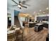Open kitchen with stainless appliances, central islands, breakfast table and stairs to the second floor at 11201 Newbury Hills Ave, Las Vegas, NV 89138