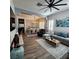 Bright, open-concept living and dining areas with wood floors, modern lighting, and stylish furnishings at 11201 Newbury Hills Ave, Las Vegas, NV 89138