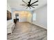 Spacious living area featuring elegant wood-look floors, neutral decor, and abundant natural light at 11201 Newbury Hills Ave, Las Vegas, NV 89138