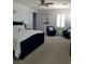 Primary bedroom with cozy sitting area, carpet and shuttered window at 11201 Newbury Hills Ave, Las Vegas, NV 89138
