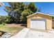 Backyard featuring a yellow storage shed and tree at 1127 Melville Dr, Las Vegas, NV 89102