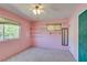 Pink bedroom featuring shelving, a window, and carpet at 1127 Melville Dr, Las Vegas, NV 89102