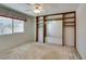 Bright bedroom with built-in shelving and a large window at 1127 Melville Dr, Las Vegas, NV 89102