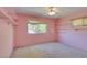 Pink bedroom with carpet, shelving, and natural light at 1127 Melville Dr, Las Vegas, NV 89102