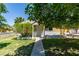 Charming single-story home featuring a well-maintained lawn and a welcoming entrance with a small porch at 1127 Melville Dr, Las Vegas, NV 89102