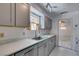 Efficient kitchen layout featuring modern appliances, extensive cabinet space, and a view of the adjacent room at 1127 Melville Dr, Las Vegas, NV 89102