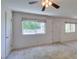 Bright living room with neutral carpet, enhanced by natural light and views of the outdoors at 1127 Melville Dr, Las Vegas, NV 89102