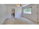 Bright living room with neutral carpet, featuring an open layout and multiple entrances at 1127 Melville Dr, Las Vegas, NV 89102