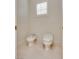 Cozy water closet features a toilet and bidet with a shuttered window at 11527 Morning Grove Dr, Las Vegas, NV 89135