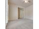 Bright, neutral bedroom features a ceiling fan, large window and plush carpeting at 11527 Morning Grove Dr, Las Vegas, NV 89135