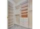 Custom walk-in closet features white shelving, drawers, and ample storage space at 11527 Morning Grove Dr, Las Vegas, NV 89135